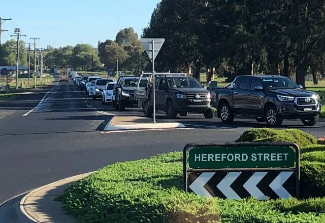LONG WAIT: Traffic banked up at the roundabout at the Trinity Heights shops.