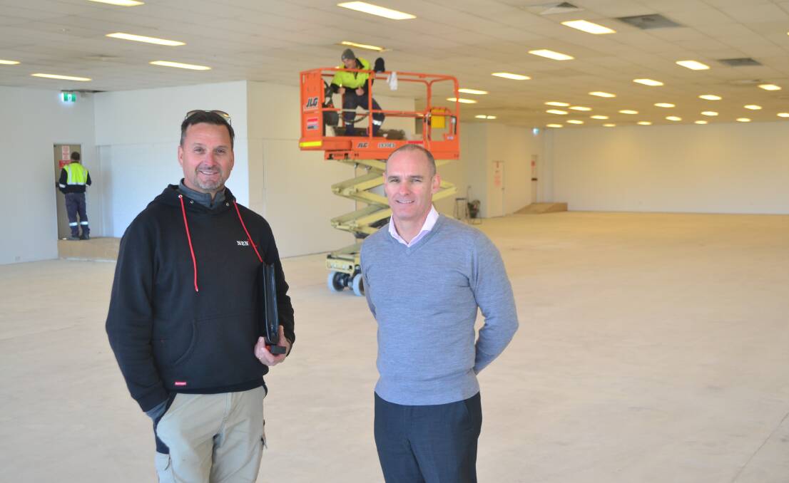 ACTIVITY: Owner Nick Petrinovic and agent David Nicoll inside the former Harvey Norman building, which is being refurbished.