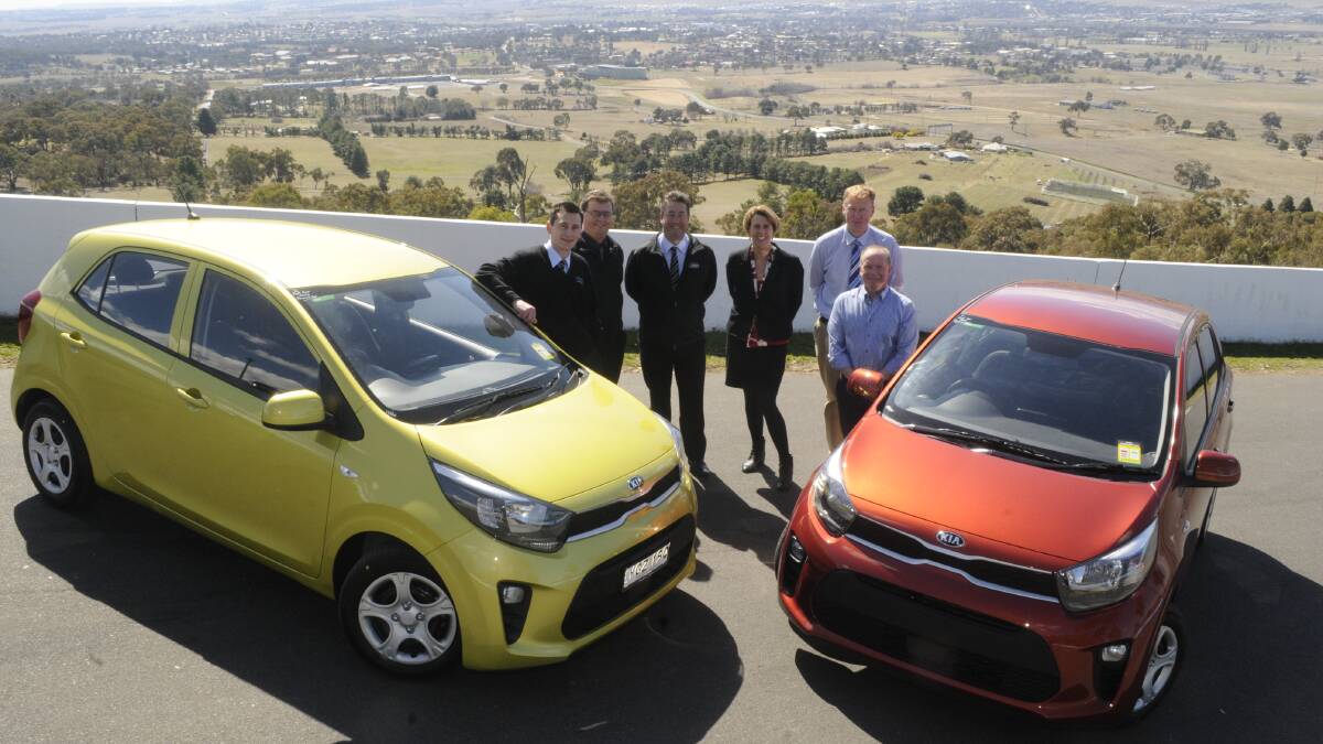 ON THE ROAD: Brendon Fush of Clancy Motors, Bathurst City Centre retail manager Ivan Christian, Clancy Motors dealer principal Michael Pentecost, Janeen O'Shea from Bathurst Broadcasters, Bathurst Regional Council acting director of environmental, planning and building services Richard Denyer and Western Advocate advertising manager Nils Gustafson launch the Kia Picanto giveaway.