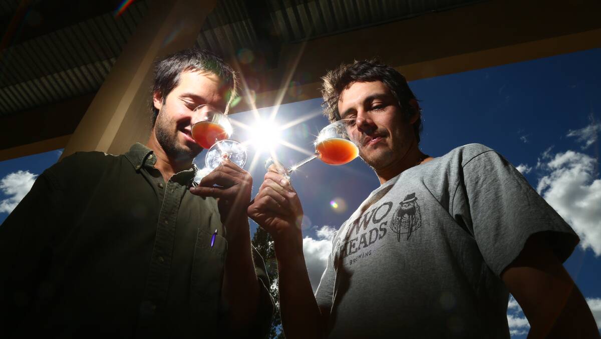 RAISE YOUR GLASS: Sam Renzaglia of Renzaglia Wines and Two Heads head brewer Ian Carman. Photo: PHIL BLATCH 041618pbtwo2