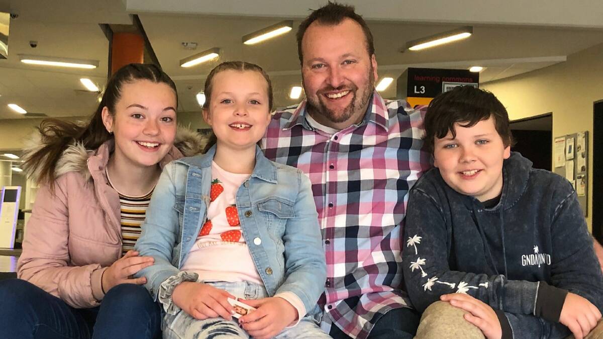 NEW DIRECTION: Iain Wood, pictured with his children Tianah, Clara and Tristan, has made a late life decision to study teaching.