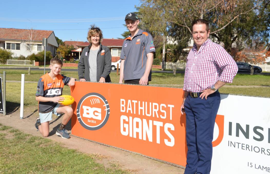 HELPING HAND: Member for Bathurst Paul Toole at George Park 1 with Will, Kathy and Sam Sloan from the Bathurst Giants Aussie Rules Club, which
will receive a NSW Government sports grant of $15,000 for two new interchange
benches.