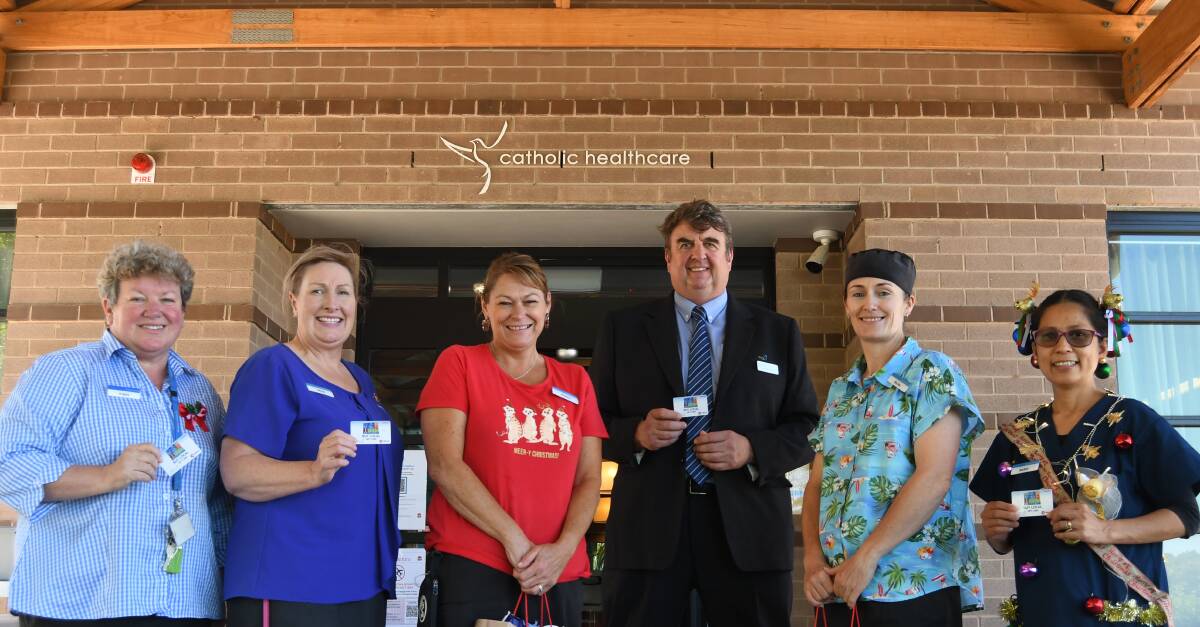 LOCAL FOCUS: St Catherine's residential manager Angela Stocks, Alicia Ellis, Andrea Rivett, council's business development officer David Flude, Nicole Pears and Barbara Willott.