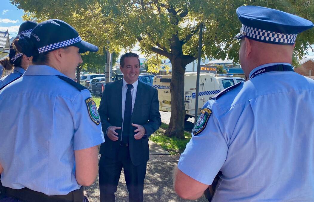TALK ABOUT IT: Member for Bathurst Paul Toole discussing an extension to the successful Youth on Track program with local police officers.