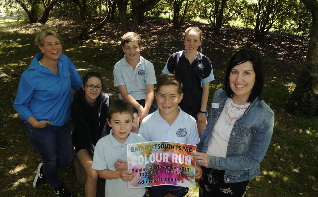 JOIN US: Event co-ordinator Bianca Young and year six students Kyah Burke, Zane Newham and Grace Chemello and (front) year three student Nicholas Fraser, year four student Floyd Young and Bathurst South Public assistant principal Michelle Chiaramonte. Photo: CHRIS SEABROOK 102417colourun