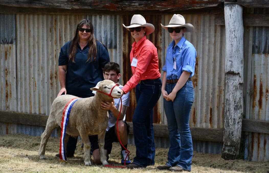 CHAMPION: Rydal Show secretary Rachael Young, a Skillset Bathurst student and judges Katrina Abbott and Claire Tilley with the champion ram. Photo: SUPPLIED.