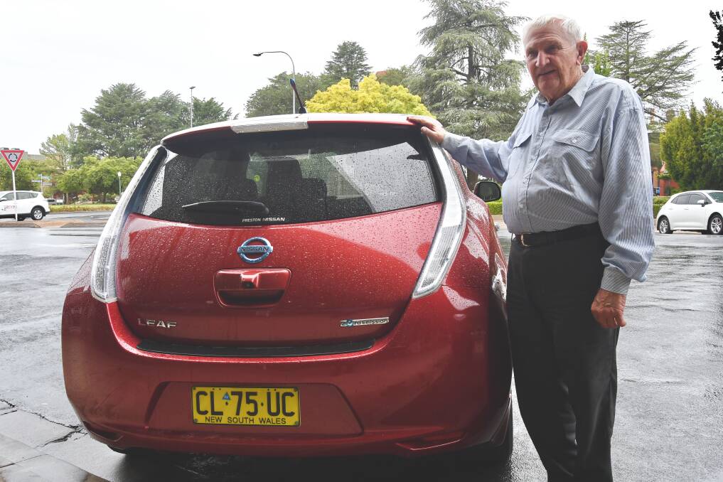 POWERFUL: Lindsay Cox with the Nissan Leaf electric vehicle he bought because he wanted to try out the technology.