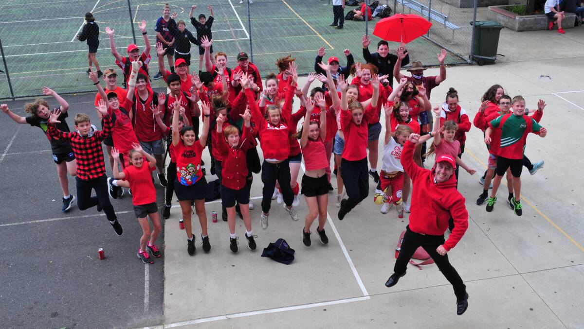 JUMPING FOR JOY: Denison College Bathurst Campus principal Ken Barwick showing how pleased he was with the support shown to Wear Red Day back in March.