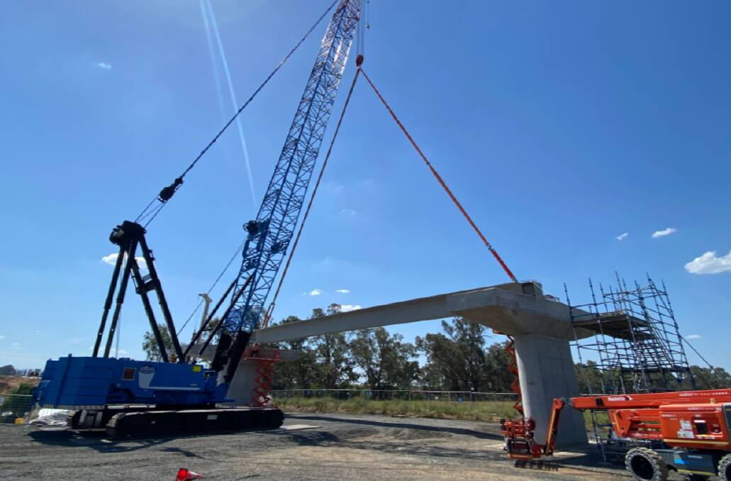 Heavy machinery at work on a new bridge over the Macquarie River at Dubbo. Picture from Transport for NSW.