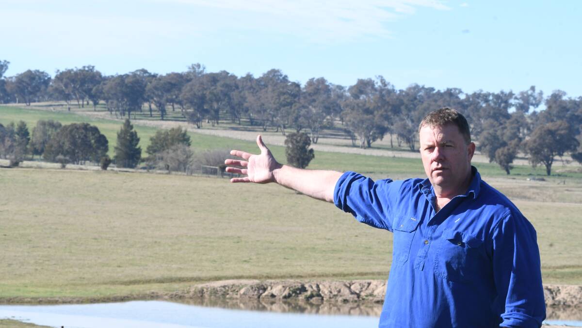 CONCERN: Cangoura Solar Action Group president Andrew Rendall pointing to the treeline he says will be affected by a proposed solar farm. Photo: CHRIS SEABROOK 080420csolar