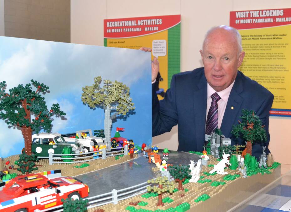 BRICK BY BRICK: Mayor Graeme Hanger with one of the models of Mount Panorama-Wahluu at the Australian Fossil and Mineral Museum. 040717lego2