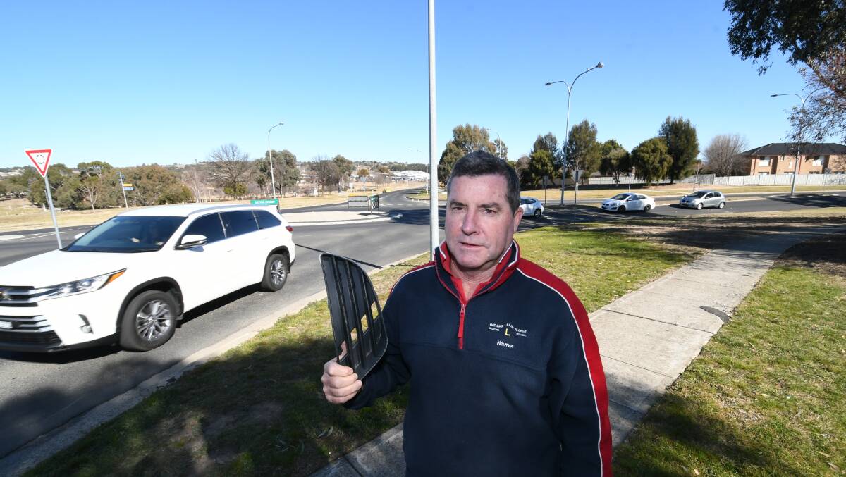 BLACKSPOT: Councillor Warren Aubin at the intersection of Bradwardine Road and Suttor Street in July last year with debris from a crash there.