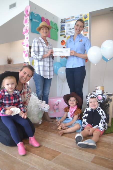 HANDOVER: Arahbella Edwards, Balance Early Education centre manager Lauren Dunn and owner Darlene Wadham, Rural Aid counsellor Zoe Cox, Laila Martin and Leo Dunn. 022819balance
