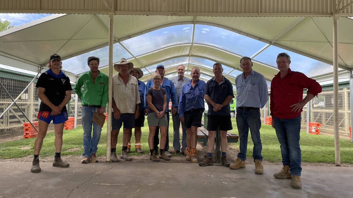 Great Southern Supreme Merino Show and Sale president Rick Power (third from right) and Pomanara Merino Stud's Geoff Rayner (second from right) and others preparing for the event at Bathurst Showground.