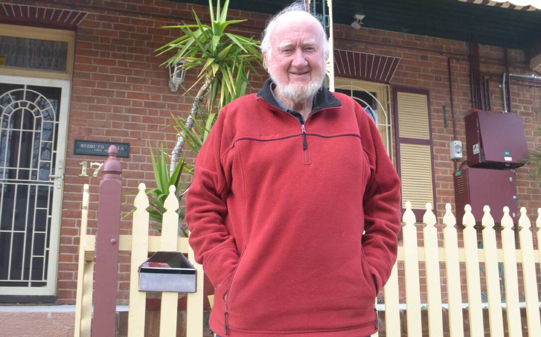 HONOURED: Adjunct Professor David Goldney outside his home in George Street, a terrace that he and his wife bought six months after they arrived in Bathurst.