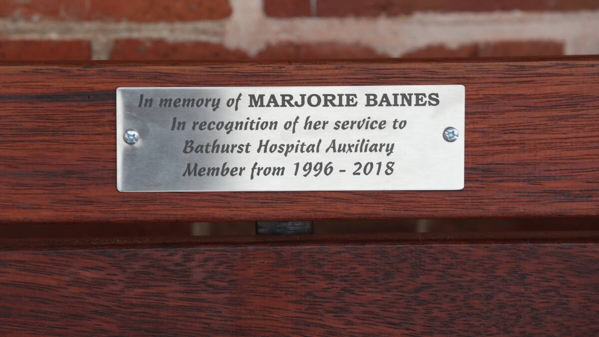 Seat and plaque remembers long-time auxiliary member Marj