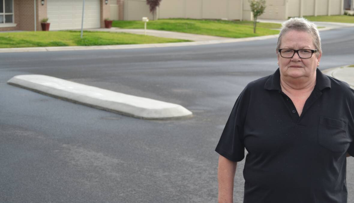 UNHAPPY: Press Court resident Cheryl Weiss says a traffic island installed at the entrance to the cul-de-sac won't solve problems for those turning into the street.