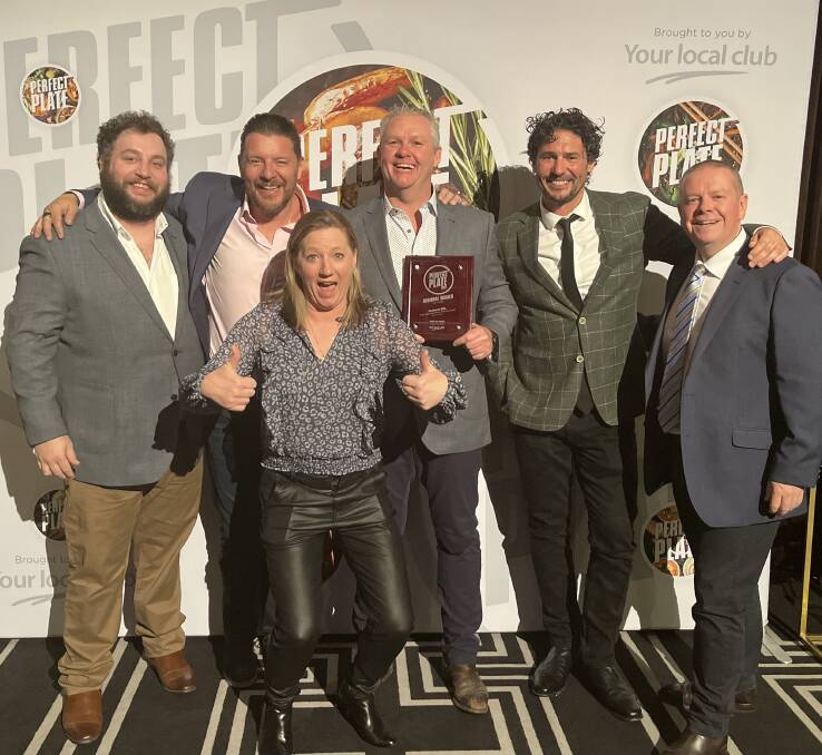 BIG WIN: Celebrity chefs Manu Feildel (second from left) and Colin Fassnidge (second from right) with Bathurst RSL Club head chef George McFarland, catering supervisor Jenny McNab, operations manager Mark Burns and CEO Peter Sargent.