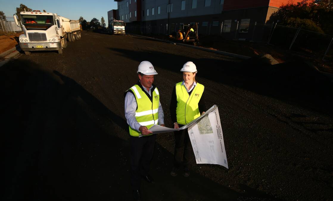 SPACE RACE: Hines Constructions' David Hines and project manager Lindsi Frisby during the construction of the new car park at Bathurst Hospital.