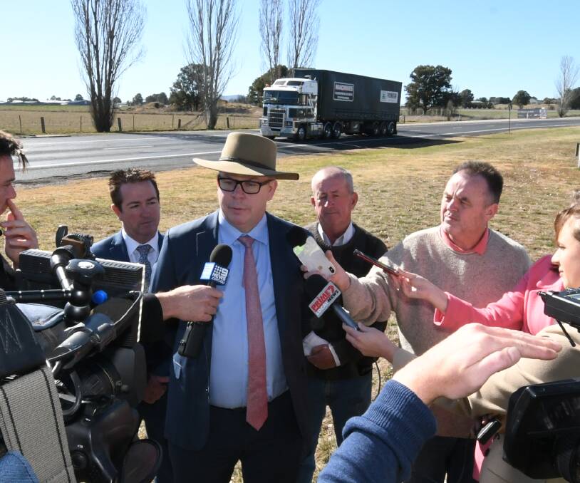 ON THE ROAD: Transport for NSW western regional director Alistair Lunn addresses the media at Raglan in July. Also pictured are Bathurst MP Paul Toole and deputy mayor Bobby Bourke. Photo: CHRIS SEABROOK 072319cupgrade2