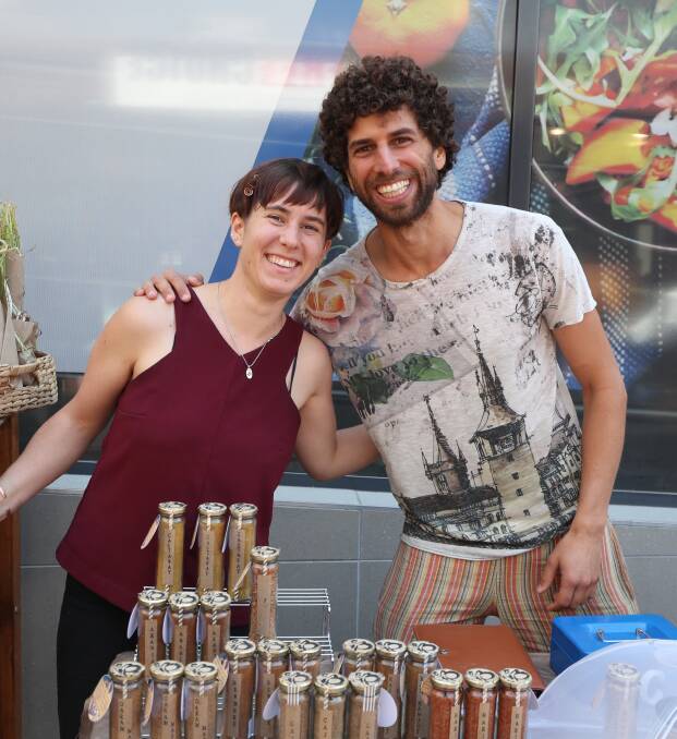 SMILES: Madeline Schmidt and Nathan Gatt at the market last month.