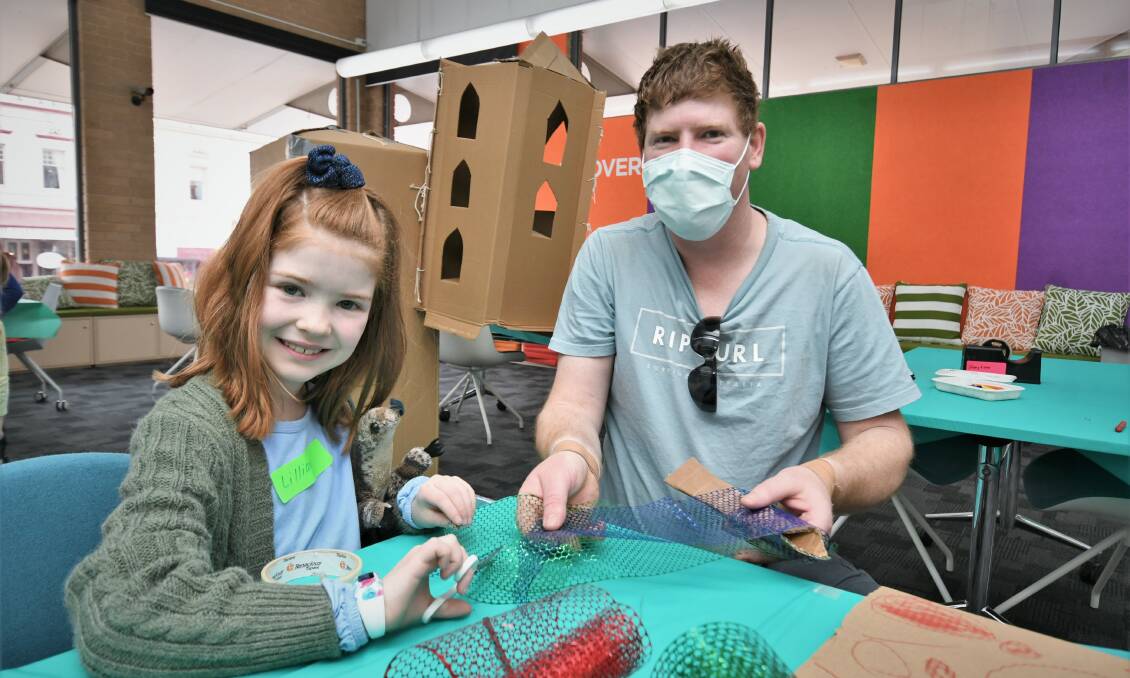 CUT THAT OUT: Lillian, 8, and Luke Renshaw at Bathurst Library this week. Photo: Chris Seabrook 062921clibrary3