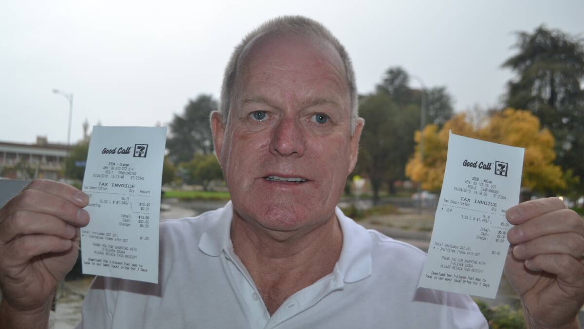BARGAIN: Bill Lamers with his receipt from Orange 7-Eleven showing he paid 134.9 cents a litre for fuel - 15 cents a litre less than he later paid at the same outlet in Kelso.