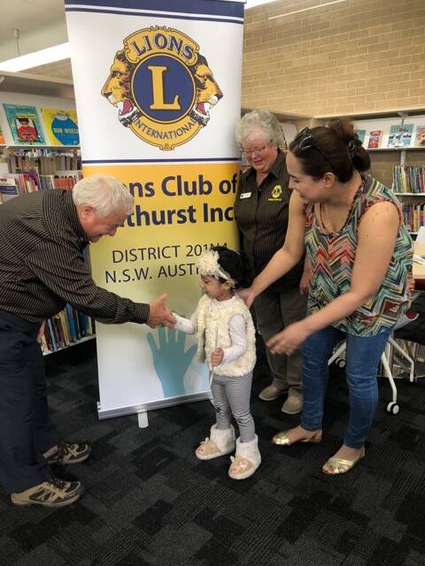 LOOK HERE: Dominic and Judy Chircop from the Lions Club of Bathurst have been promoting the eye health message to parents at Bathurst Library. Photos: SUPPLIED