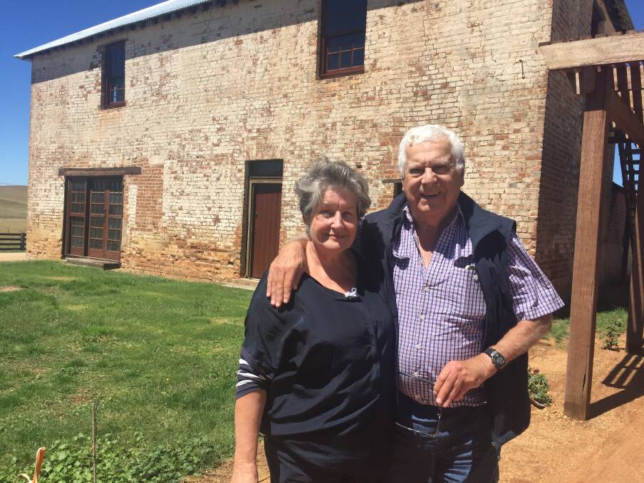 RESTORATION: Bonny and Paul Hennessy outside the restored two-storey convict barracks at "Macquarie", which will be open this weekend.