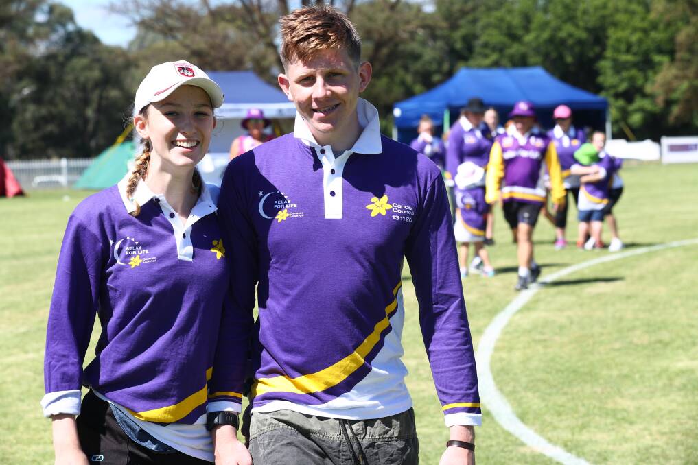DOING A LAP: Aish Cowgill and Paddy Cantrill took part in last year's Bathurst Relay for Life. Photo: PHIL BLATCH 031018pblife4