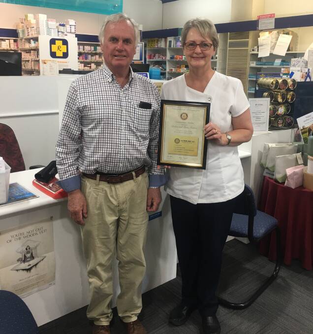 RECOGNITION: Rotary Club of Bathurst East past president Peter Keith presents a certificate of appreciation to pharmacist Fiona Forbutt.