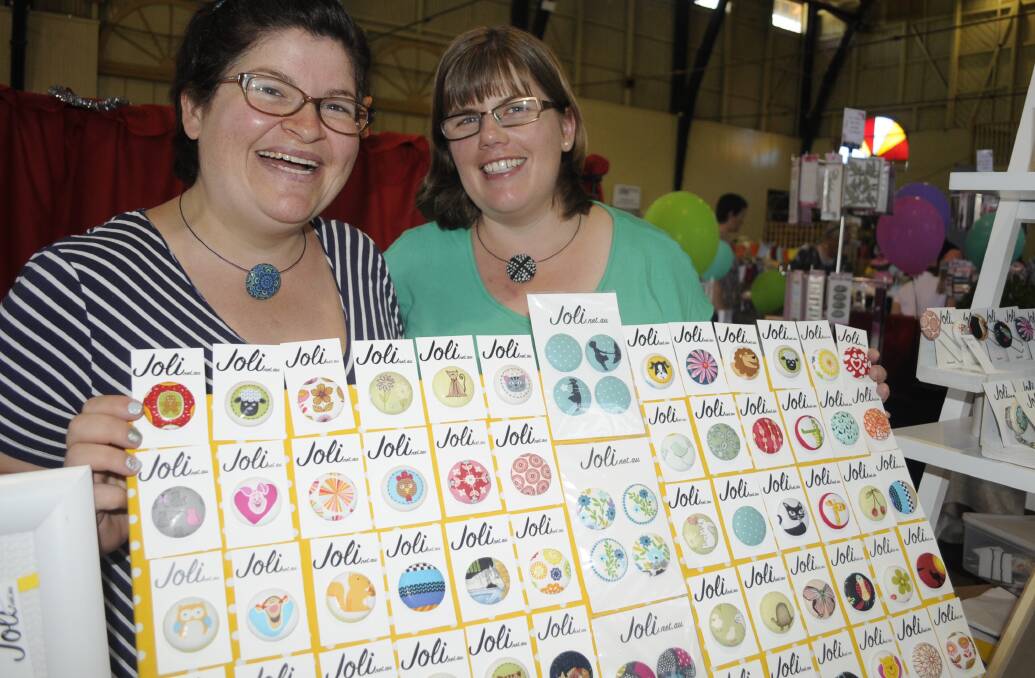 PUSHING BUTTONS: Nicola Krahe and Sally Vaughan selling their Joli buttons, hand-made in Bathurst. 112016cexpo10