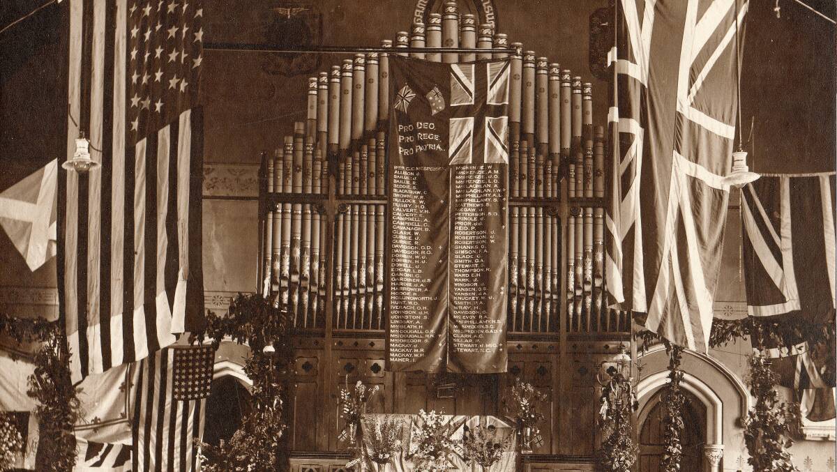 LEST WE FORGET: Unveiling the silk honour roll banner at St Stephen's Church on Armistice Day 1918.