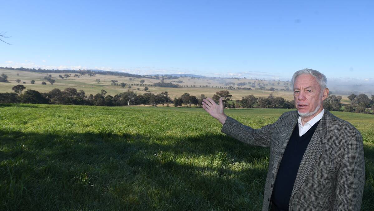 CONCERNED: Lachlan Rendall showing the valley in the middle distance where the intended solar farm is to be placed. Photo: CHRIS SEABROOK 063020csolarfm1