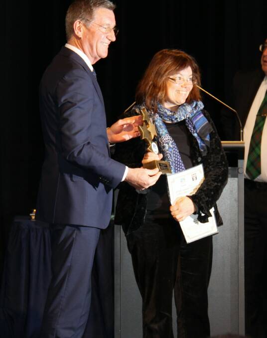 WELL DONE: Mayor Gary Rush presents the first place winner trophy to Tracy Sorensen at the Bathurst Remembers Bicentenary Event and Filmmaking Awards evening.