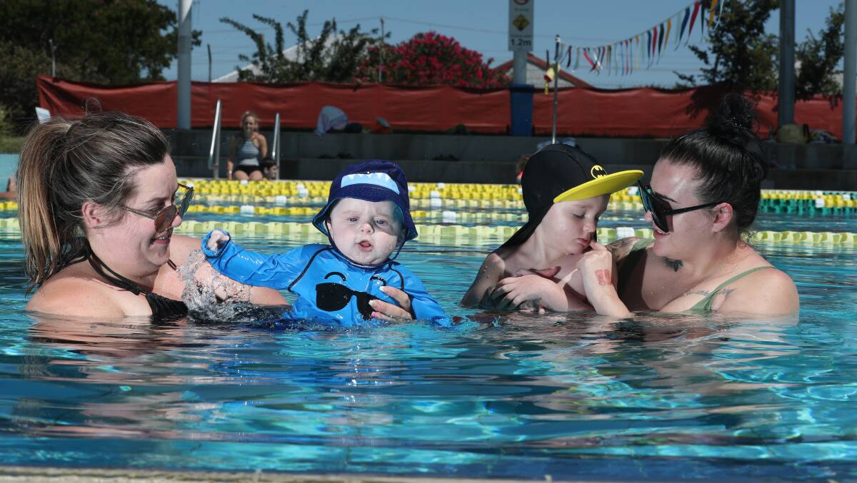 MAKING A SPLASH: Kayla and Benson Comerford and Jessy Finn and Benji Chamberlain cool off at the pool, which is set to be popular this week. Photo: PHIL BLATCH 122918pbhot2