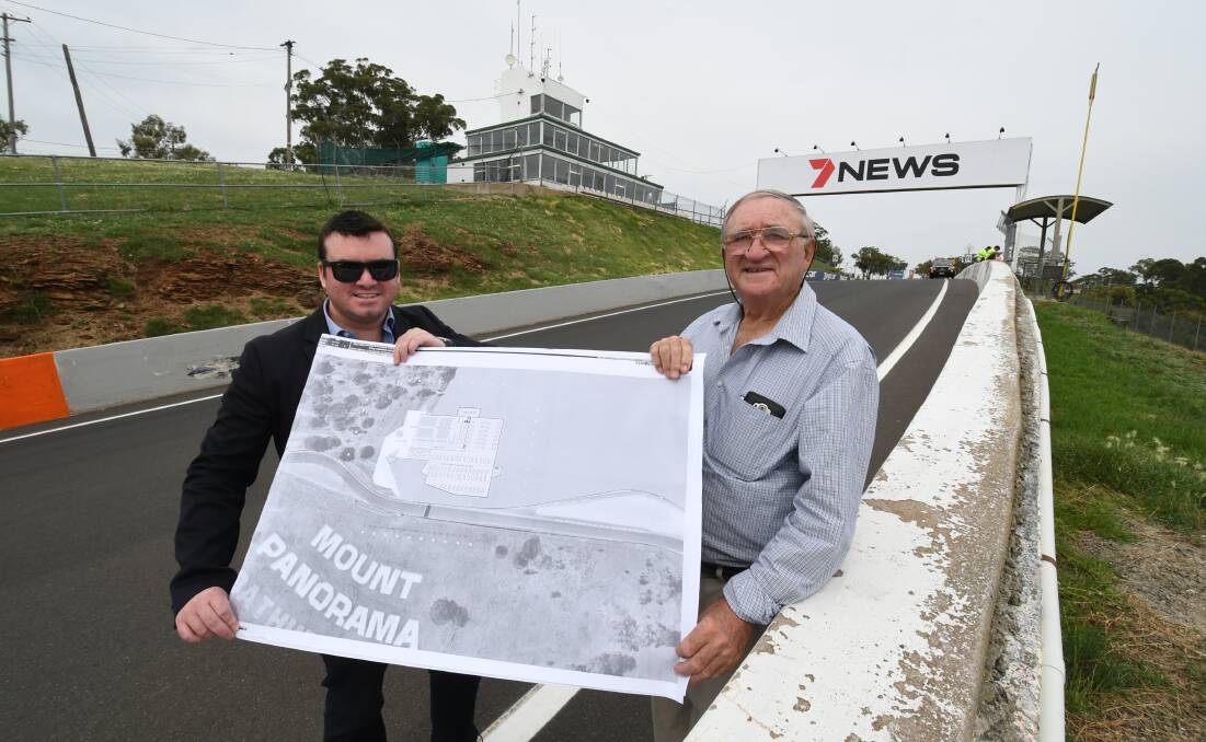 VISION SPLENDID: Architect Blair McFarland and farmer Jim Inwood with their plans for a multi-level facility on the top of Mount Panorama. Photo: CHRIS SEABROOK 013019cvision1