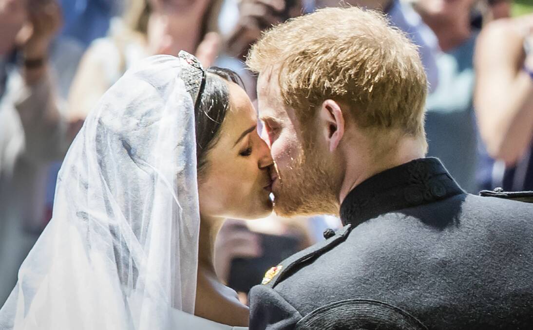 SEALED WITH A KISS: Meghan Markle and Prince Harry, pictured on their wedding day, would provide a boost for business if they travelled to Bathurst.