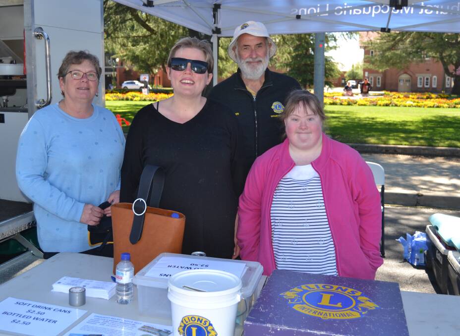HELPING OUT: UnitingCare care worker Shirley Colzato, Amber Snow, Lions Club of Bathurst Macquarie's Graham Carter and Khari Conroy at the Super Wednesday events.