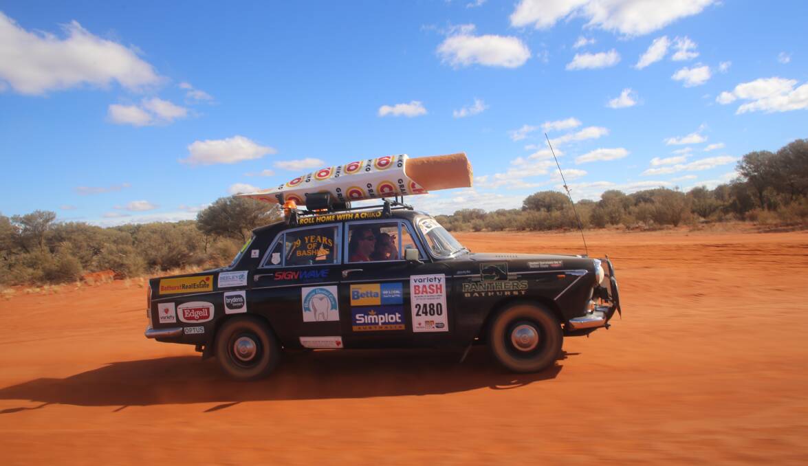 BRAITLING OR BUST: John Lindsell's well-known 1964 Wolseley 2480, with a giant Chiko Roll on top, is ready to take part in its 30th Variety Bash.