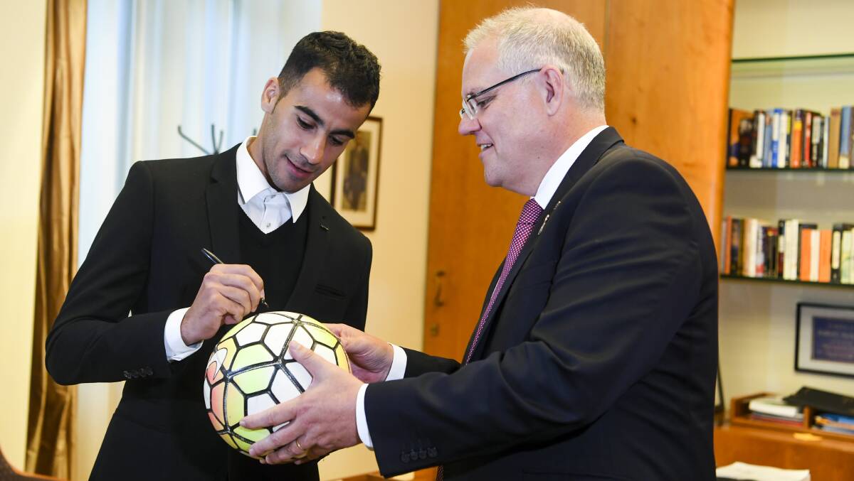 BACK HOME: Refugee Hakeem Al-Araibi and Prime Minister Scott Morrison at Parliament House in Canberra this week. Photo: AAP IMAGE/LUKAS COCH