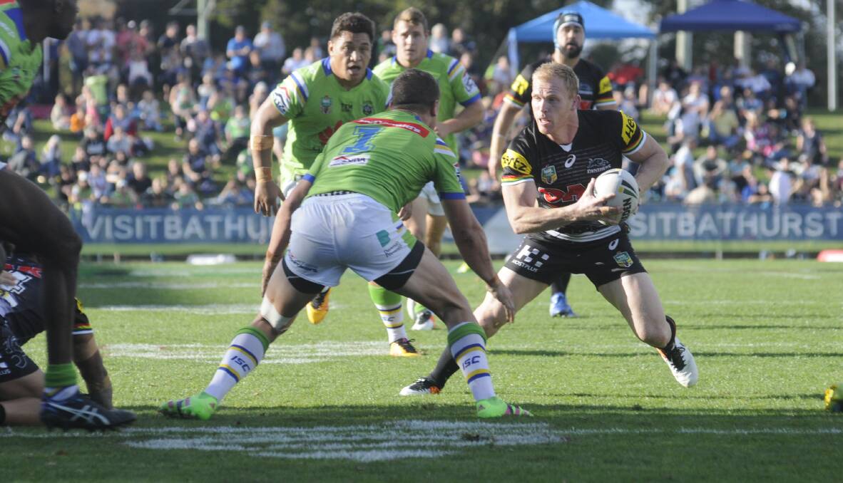 REGULAR VISITOR: The Penrith Panthers' Peter Wallace takes on the defence during the side's game in Bathurst last year. Photo: CHRIS SEABROOK