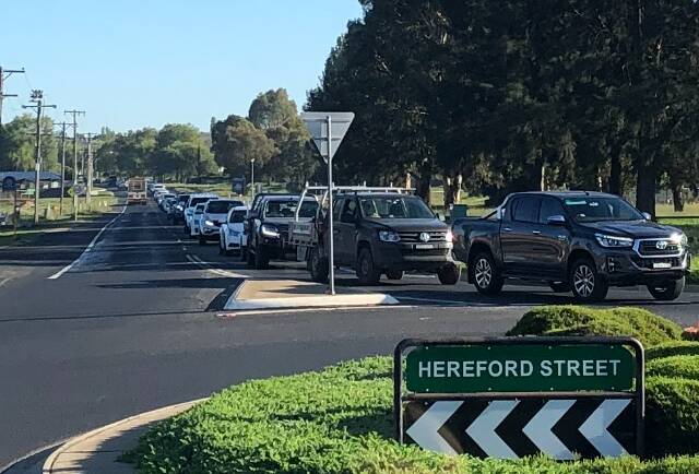 LONG WAIT: Traffic banked up at the roundabout at the Trinity Heights shops