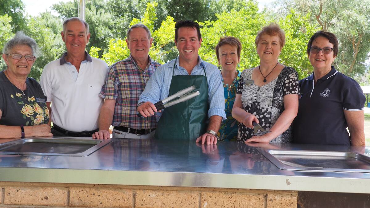FEEDING THE MASSES: Member for Bathurst Paul Toole (centre) with Bathurst Quota Club members Helen Woods, John Townsend, Andy Lyle, Janet Townsend, Judy Canon and Cate Horsburgh.