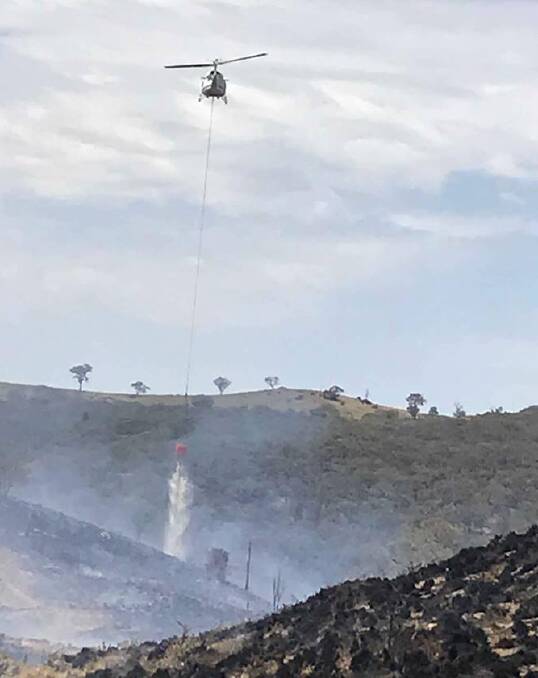 UNDER CONTROL: The NSW RFS says it took a concerted effort, including aircraft dropping water, to bring a fire near Orange under control. Photo: NSW RFS/FACEBOOK