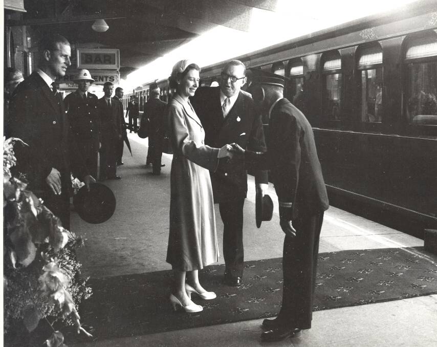 FLASHBACK: The Queen shakes hands with station master Louis Le Breton at Bathurst Station as she prepares to board the Royal Train in February 1954. Photo: STATE ARCHIVES