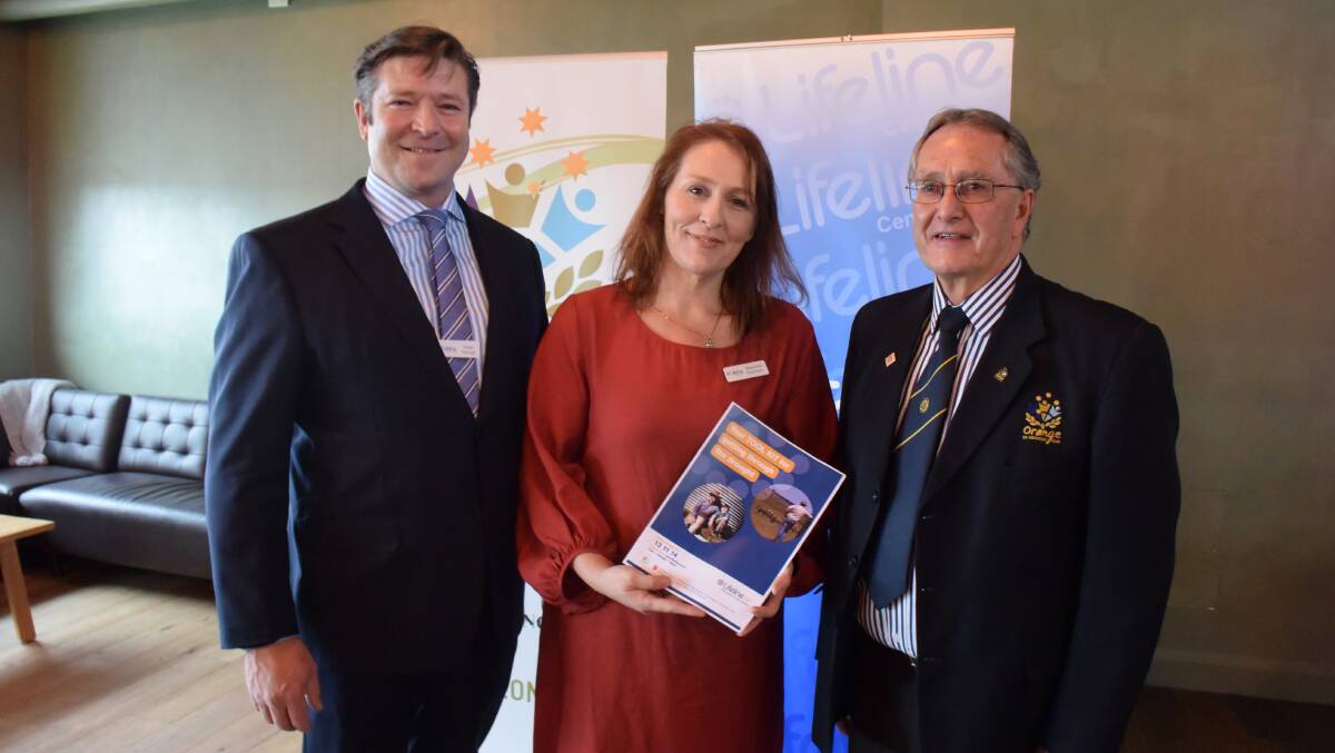 HELP: Aidan Keough and Stephanie Robinson from Lifeline Central West and Orange Ex-Services’ Club president/acting CEO Graham Gentles launch the drought tool kit at the club last Friday. Photo: DAVID FITZSIMONS 0907dflifeline1