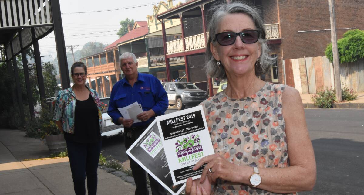 Market time: Orange360's Caddie Marshall, and Millfest volunteers Richard Beach and Sue Marsh are ready for this Saturday's street festival. Photo: Mark Logan.