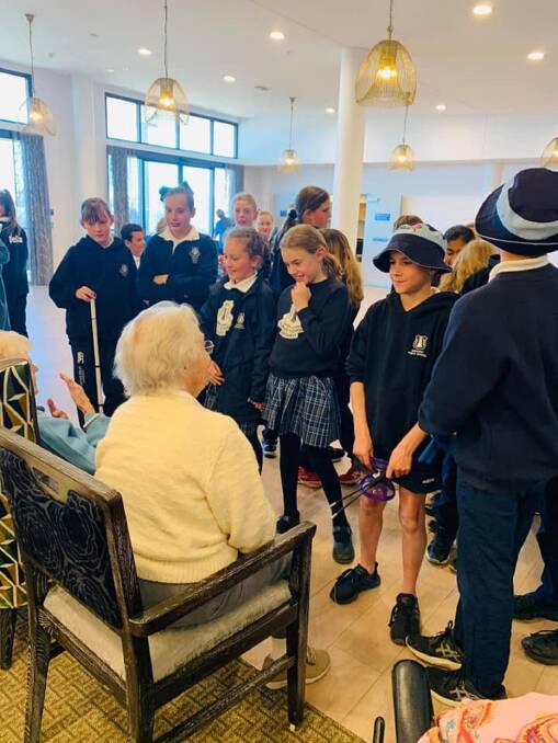 STORIES TO TELL: The children of Bathurst Public School enjoyed interacting with residents at Opal Aged Care facility as part of Education Week. Photo supplied.