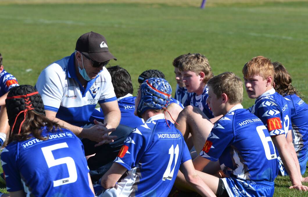 TALKING TACTICS: Chris Osborne chats to some of his Saints during half-time in the major semi-final. Photo: ANYA WHITELAW